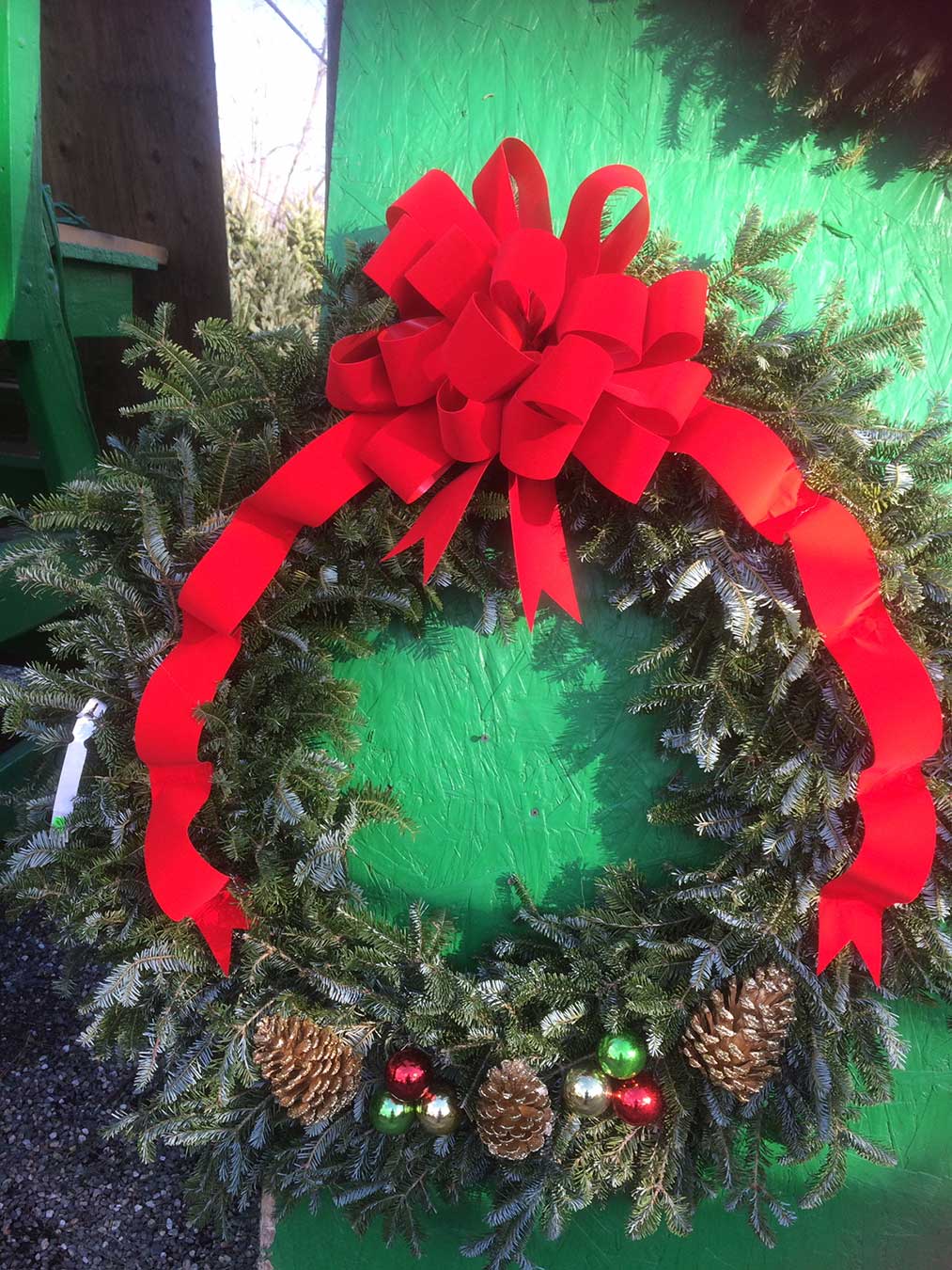 Wreath with cones ribbons and decorations